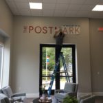 Custom vinyl lettering installed by Avanti for the Postmark