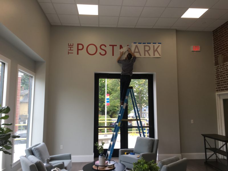 Custom vinyl lettering installed by Avanti for the Postmark